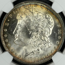 Load image into Gallery viewer, 1884-O $1 Morgan NGC MS65 -- Lustrous Gem w/ Gold & Sea Green Peripheral Toning