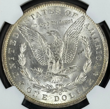 Load image into Gallery viewer, 1885-O $1 Morgan Dollar NGC MS65 -- Incredible Bright Orange & Purple Toned Gem
