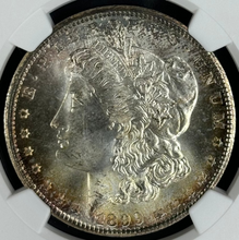 Load image into Gallery viewer, 1899-O $1 Morgan Dollar NGC MS67 Lustrous Gem w/ Minor Golden Peripheral Toning