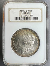 Load image into Gallery viewer, 1884-O Morgan Silver Dollar NGC MS65 -- Light Golden Peripheral Toning