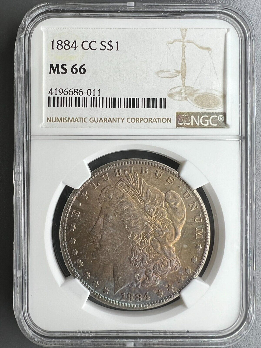 1884-CC Morgan Silver Dollar NGC MS66 - - Beautiful Golden, Blue. Burgundy Toned